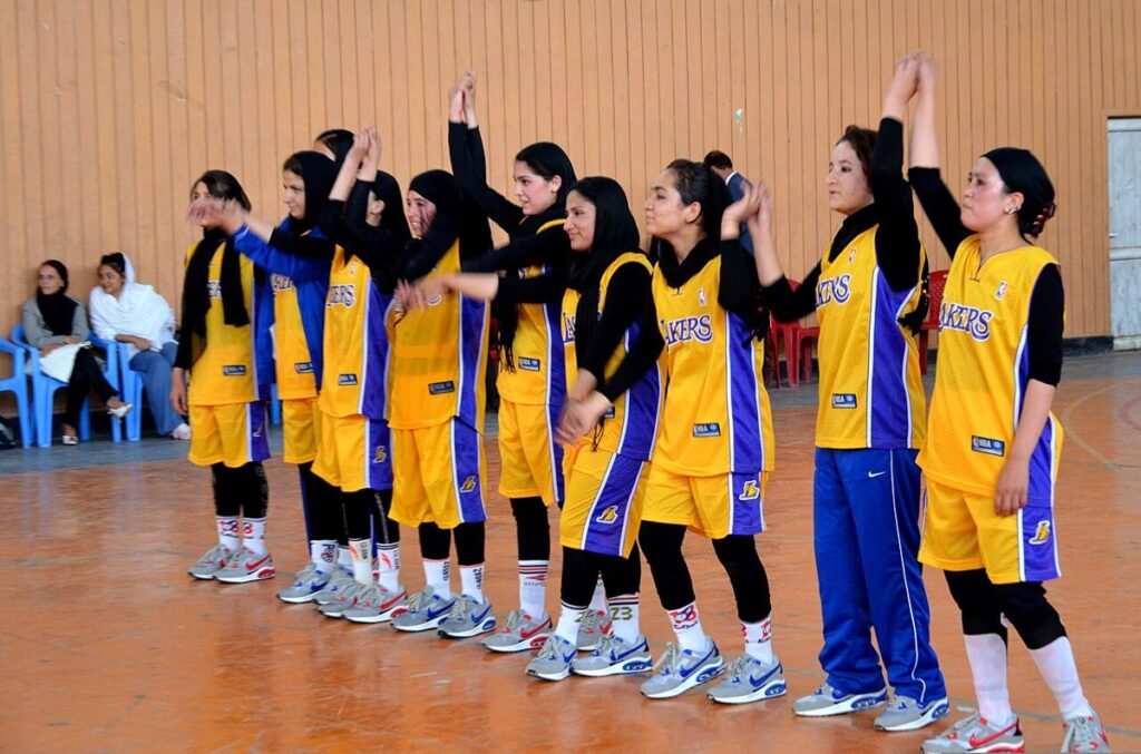 A women's basketball game in progress at an arena
