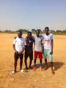 young footballers training on a grass field