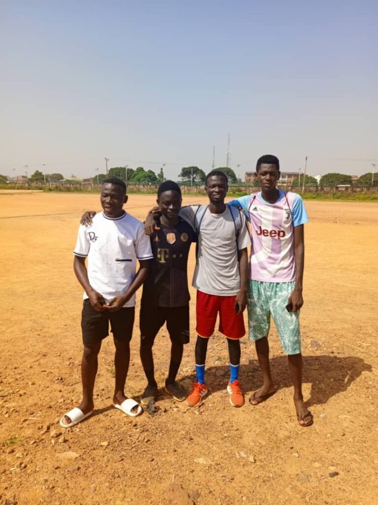 young footballers training on a grass field