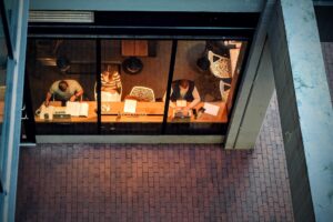 People working on laptops inside a coffee bar with public Wi-Fi